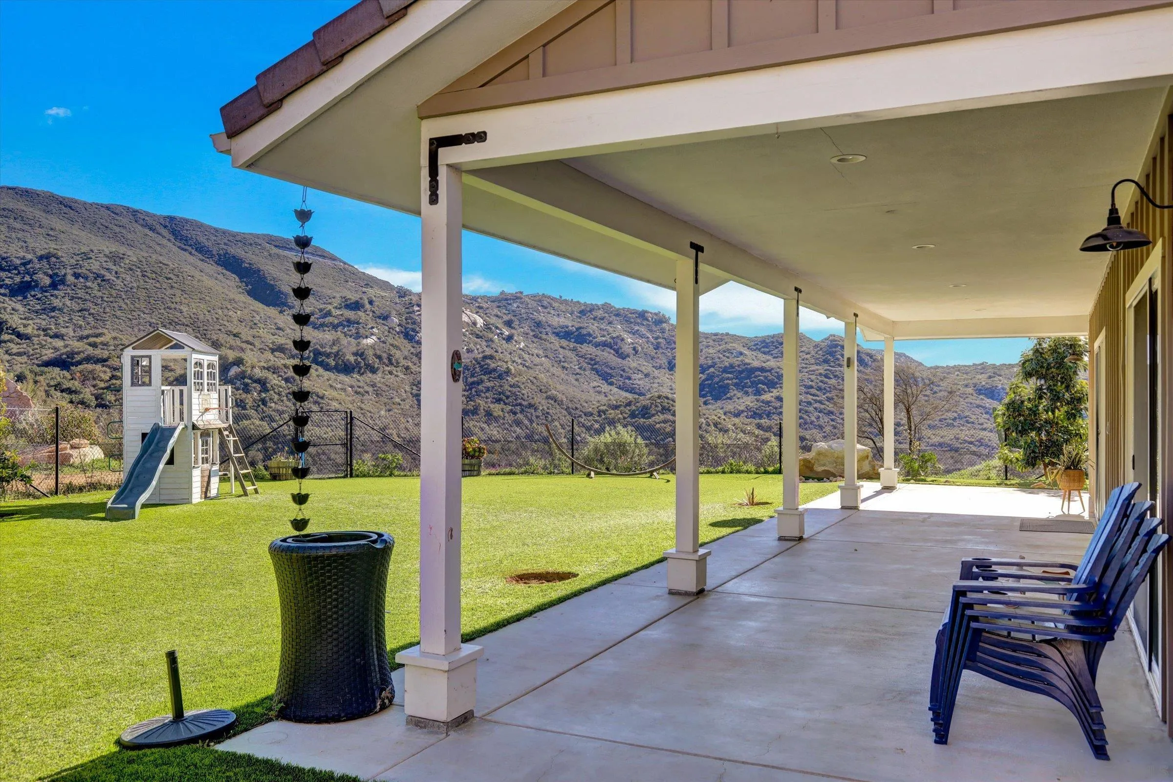 11611 Rancho Heights Road Pala, CA 92059 - Photo 32 of 43 a view of a swimming pool with a lounge chairs