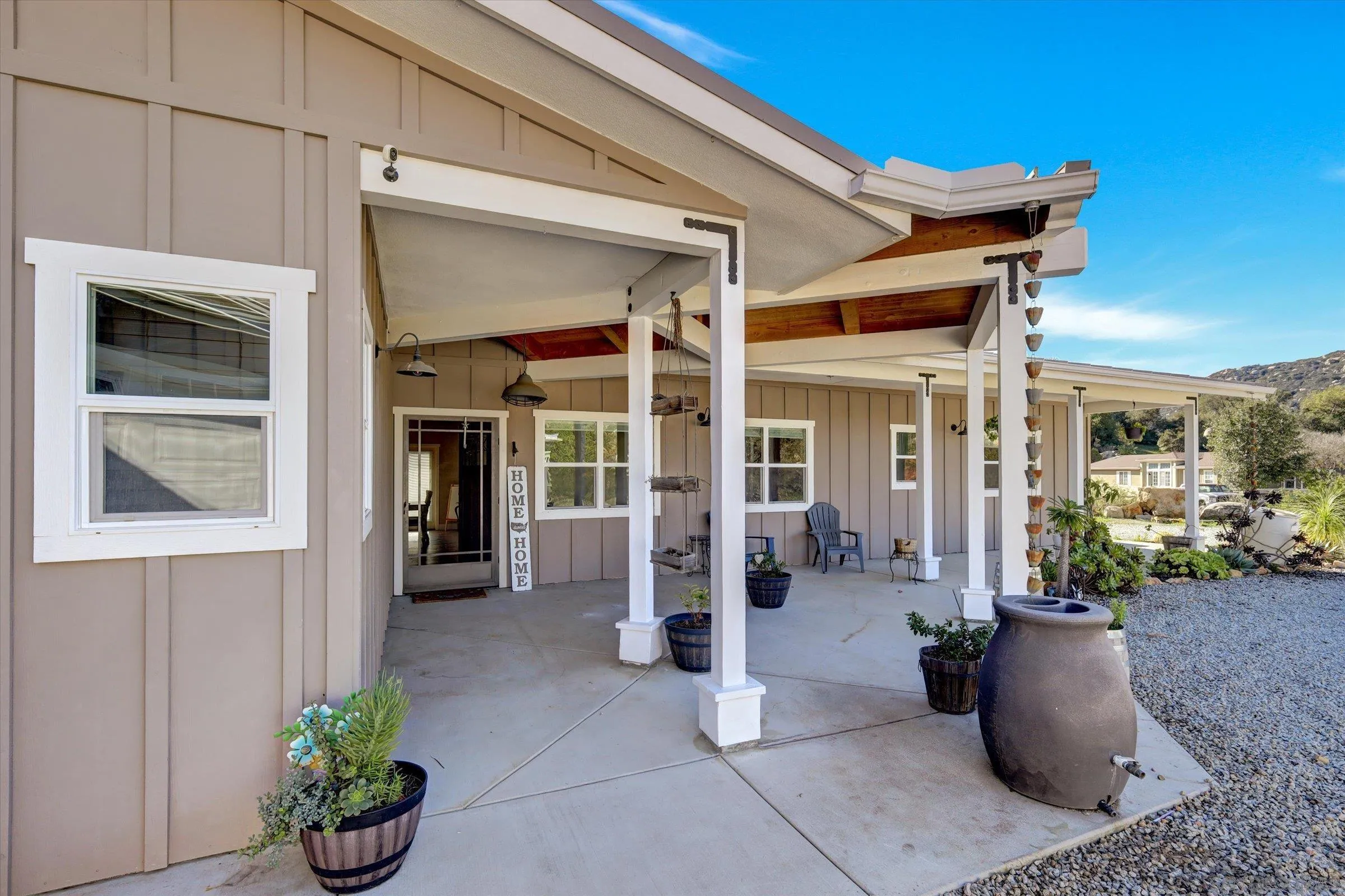 11611 Rancho Heights Road Pala, CA 92059 - Photo 37 of 43 a view of a patio with table and chairs and potted plants