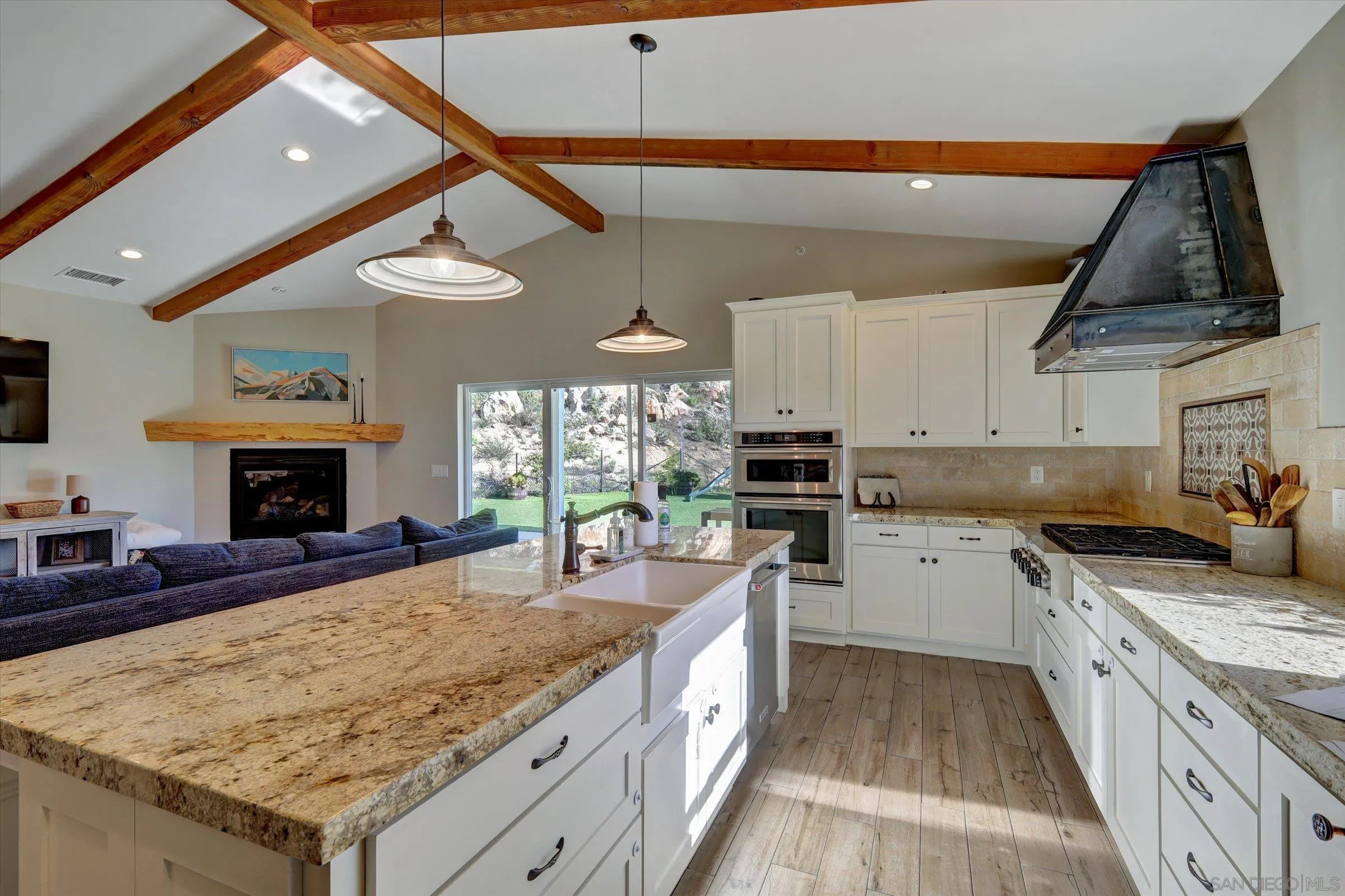 11611 Rancho Heights Road Pala, CA 92059 - Photo 4 of 43 a kitchen with sink stove and cabinets