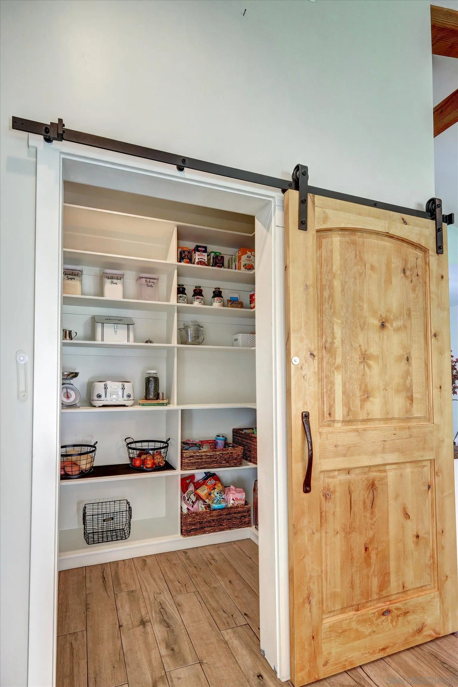 11611 Rancho Heights Road Pala, CA 92059 - Photo 6 of 43 a view of a livingroom with shelves