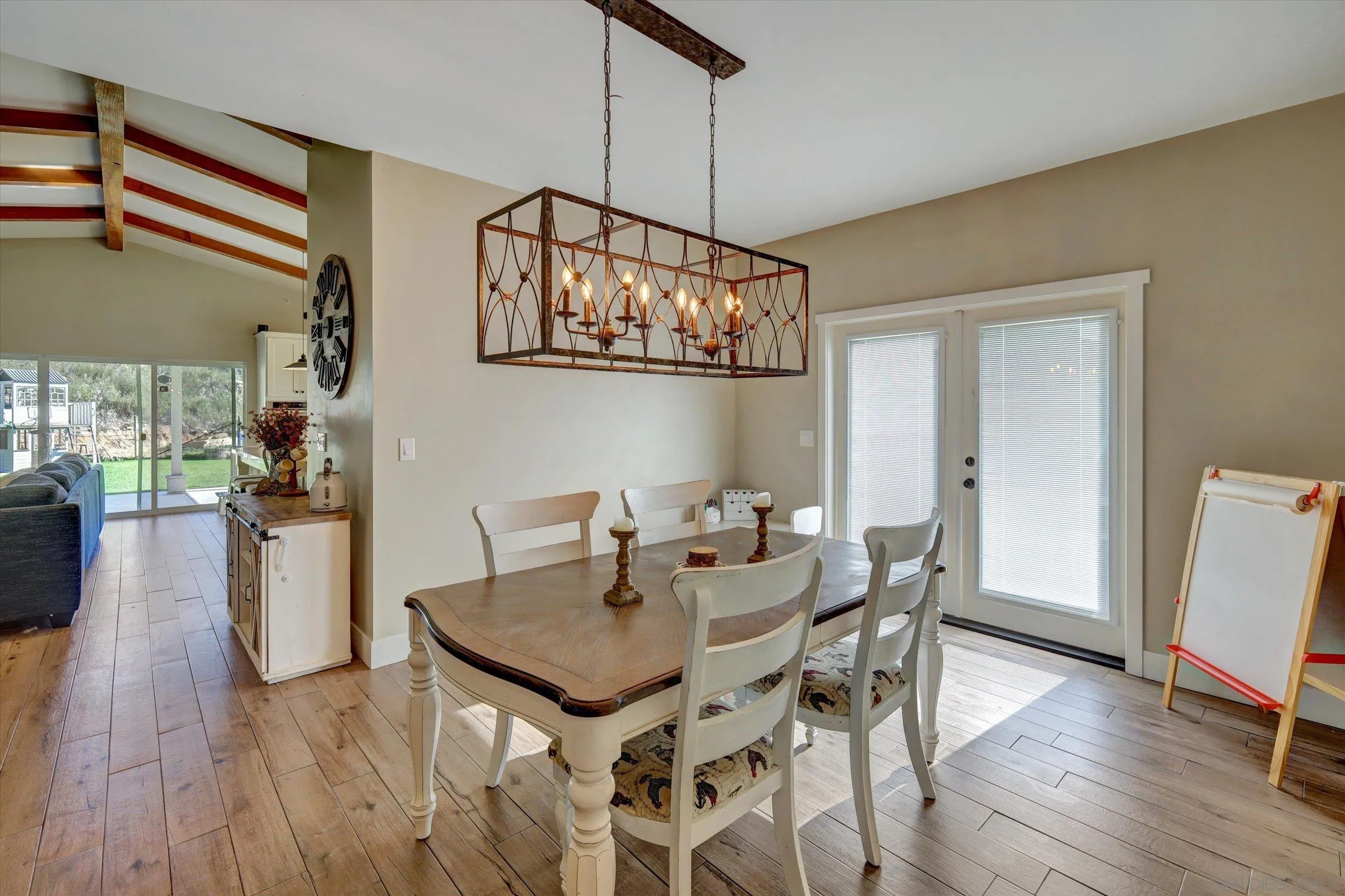 11611 Rancho Heights Road Pala, CA 92059 - Photo 9 of 43 a view of a dining room with furniture and wooden floor