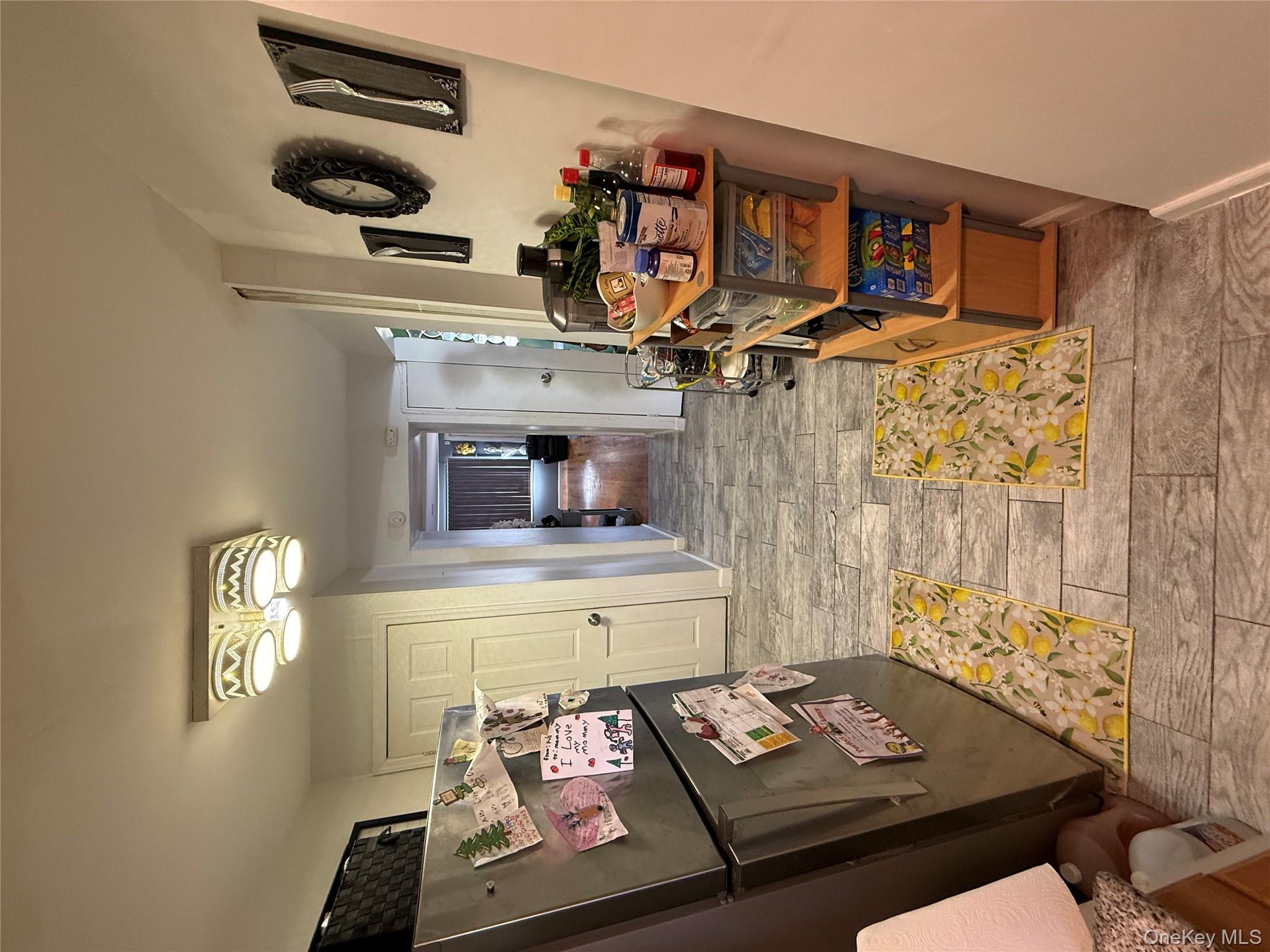 136-29 220th Place Queens, NY 11413 - Photo 19 of 45 Hall with baseboards and wood tiled floors