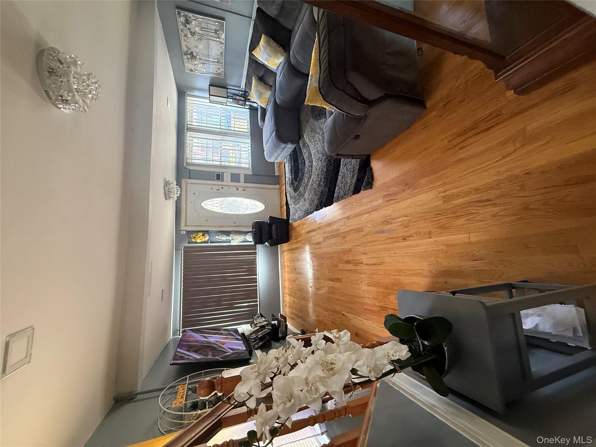 136-29 220th Place Queens, NY 11413 - Photo 25 of 45 Living room with wood finished floors