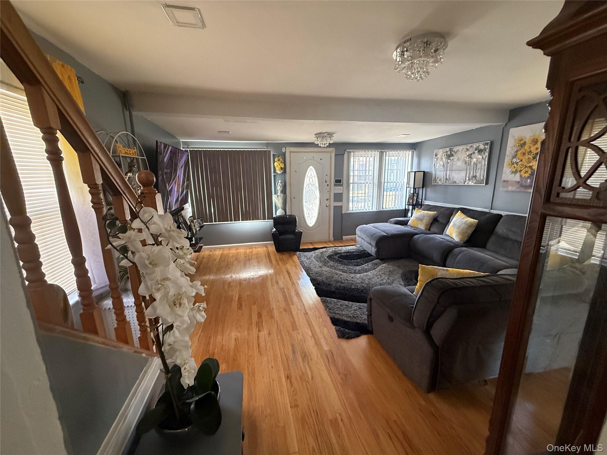 136-29 220th Place Queens, NY 11413 - Photo 26 of 45 Living area featuring wood finished floors