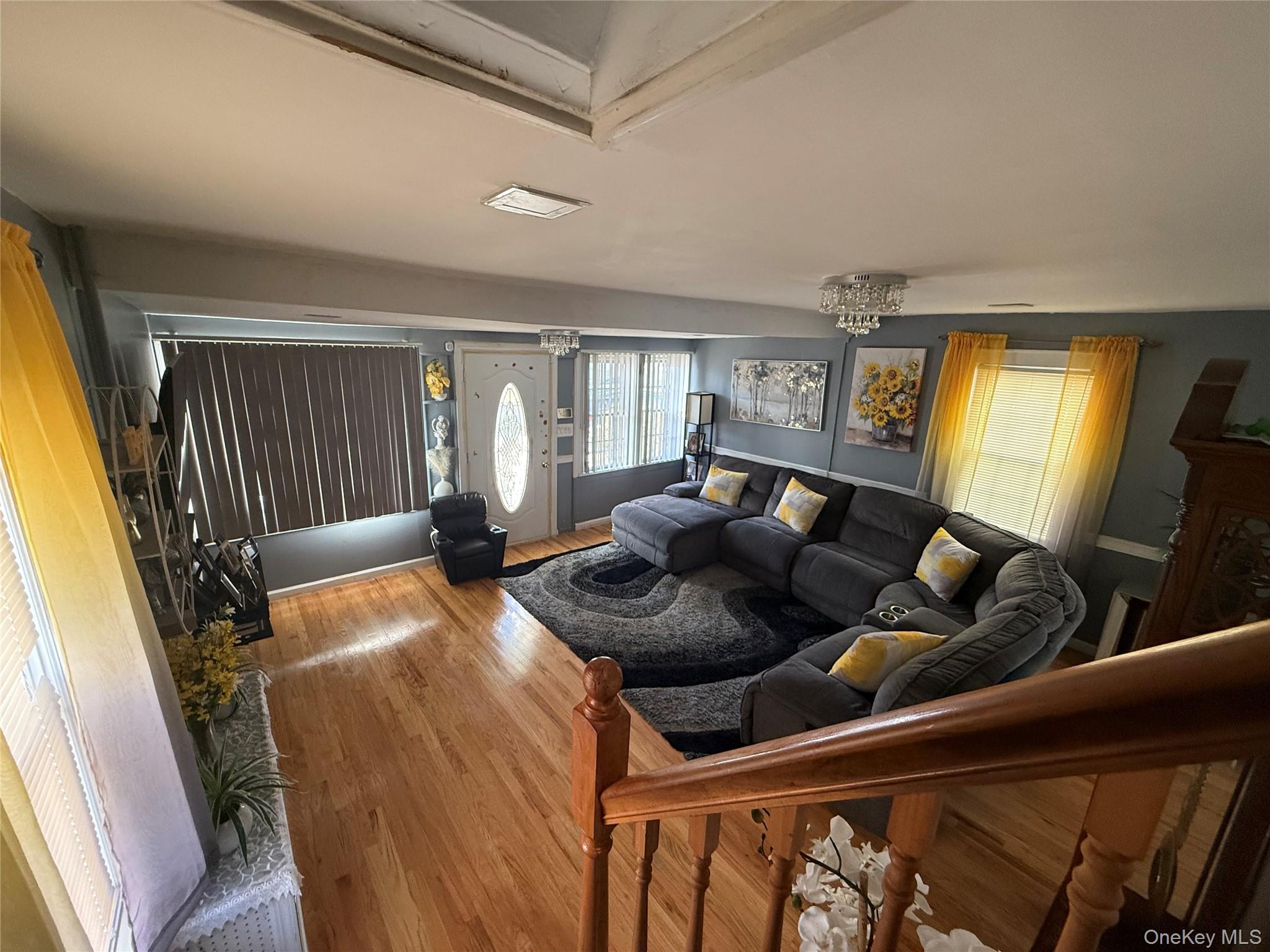 136-29 220th Place Queens, NY 11413 - Photo 30 of 45 Living area featuring wood finished floors