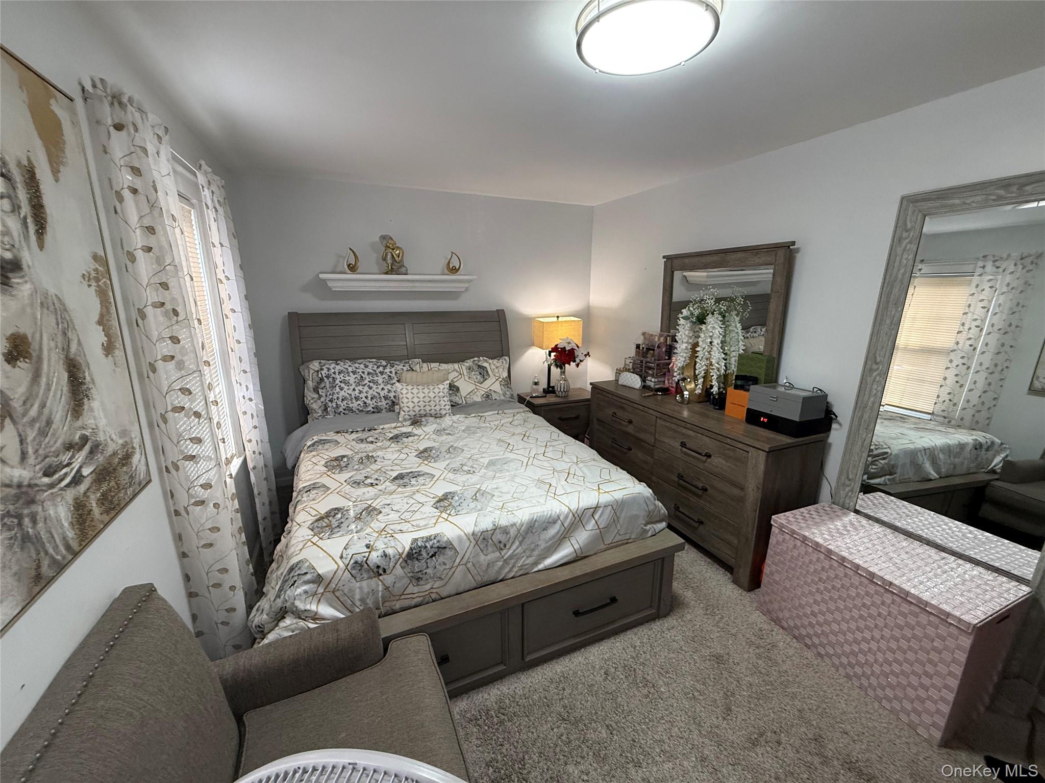 136-29 220th Place Queens, NY 11413 - Photo 36 of 45 Bedroom featuring light colored carpet