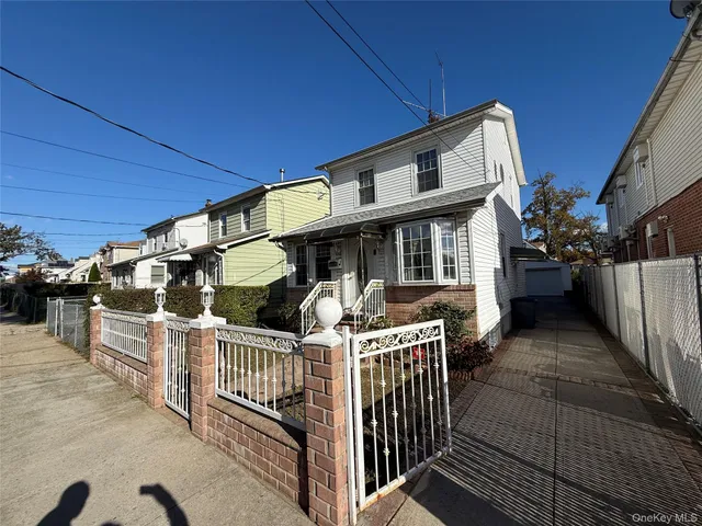 a view of a house with wooden deck front of house