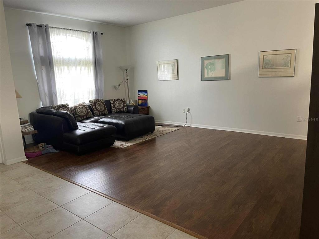Undisclosed Address Palm Coast, FL 32164 - Photo 11 of 18 a living room with furniture and a window