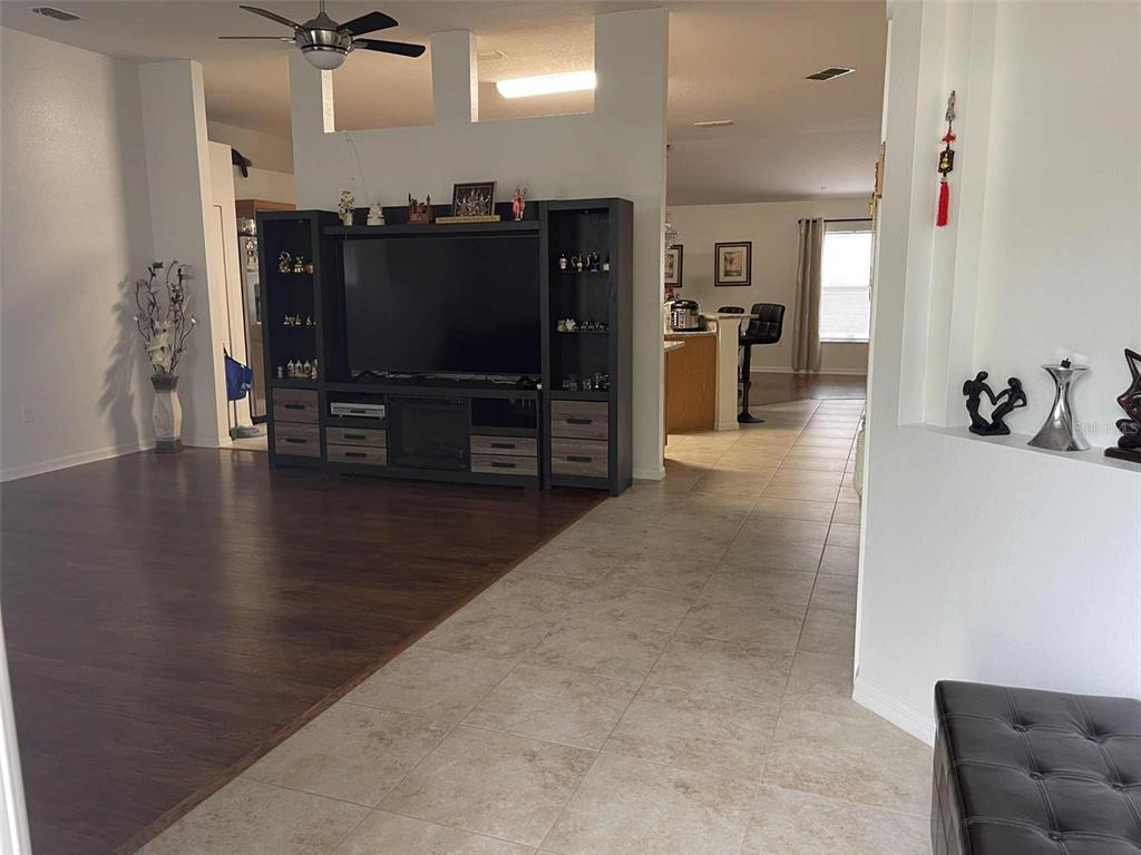 Undisclosed Address Palm Coast, FL 32164 - Photo 12 of 18 a view of a living room with furniture and a flat screen tv