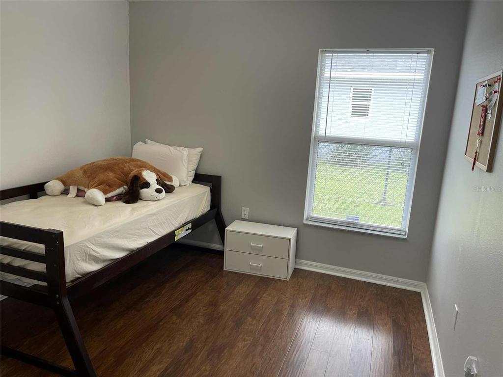 Undisclosed Address Palm Coast, FL 32164 - Photo 17 of 18 a bedroom with a bed and a window