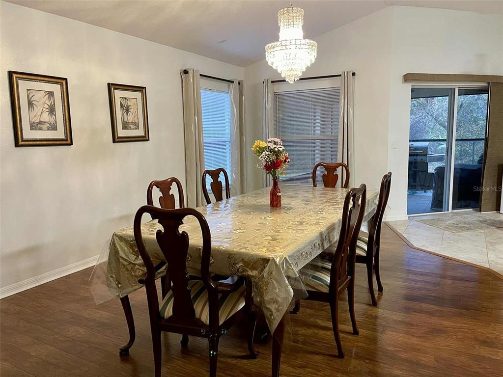 Undisclosed Address Palm Coast, FL 32164 - Photo 2 of 18 a view of a dining room with furniture wooden floor and chandelier