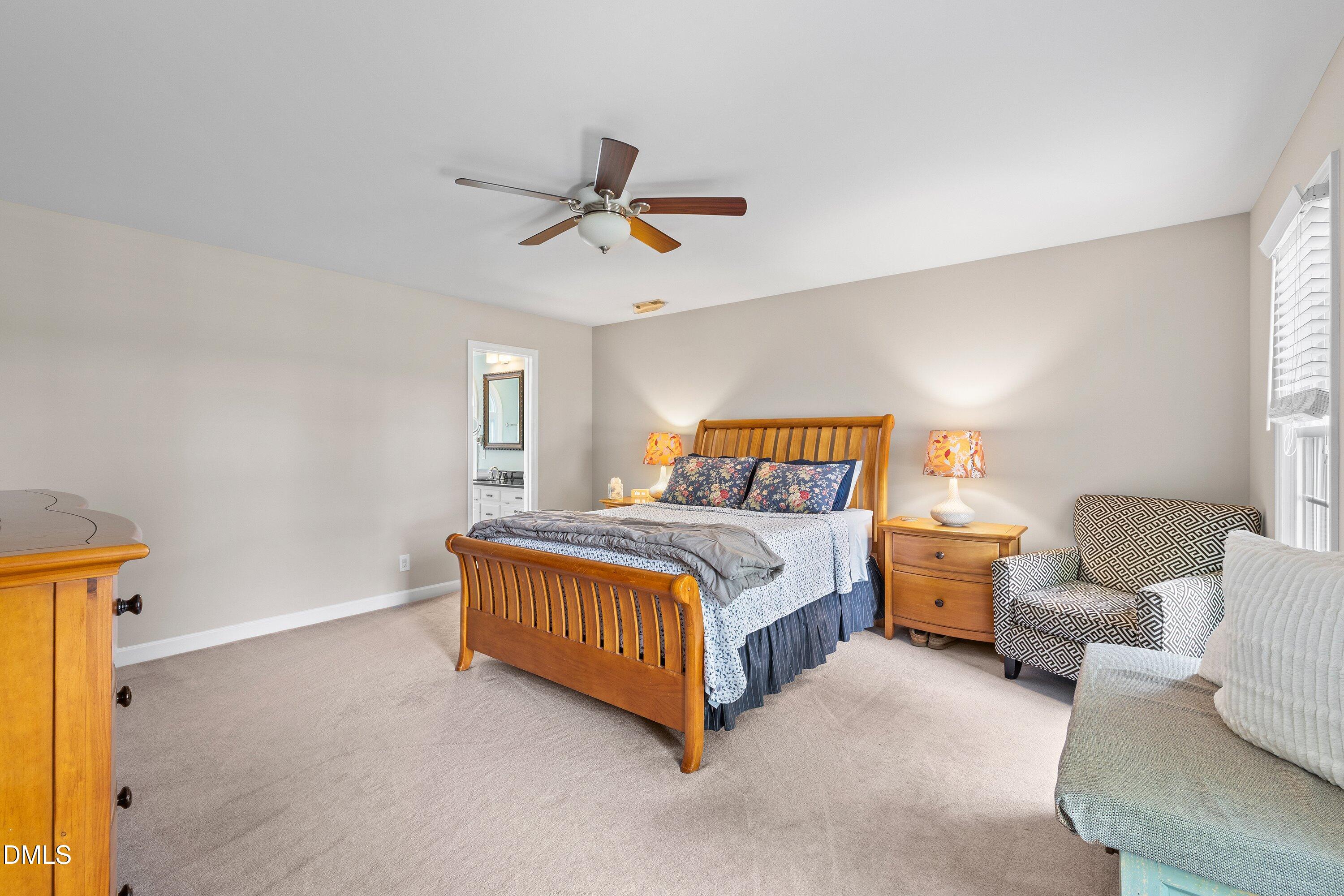 6612 Fowler Road Zebulon, NC 27597 - Photo 24 of 42 a bedroom with furniture and a window