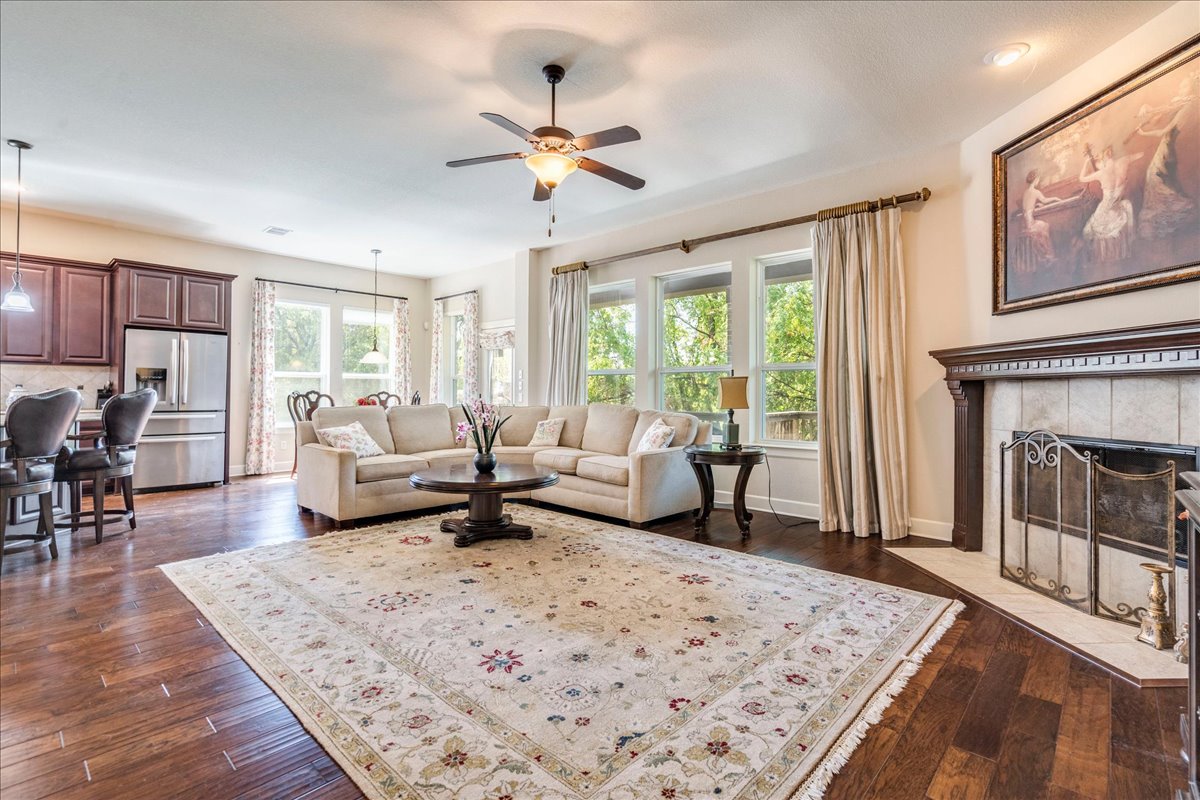 12909 Medina River Way Austin, TX 78732 - Photo 17 of 36 A classic fireplace mantel in this welcoming open living space, perfect for those cool winter evenings.