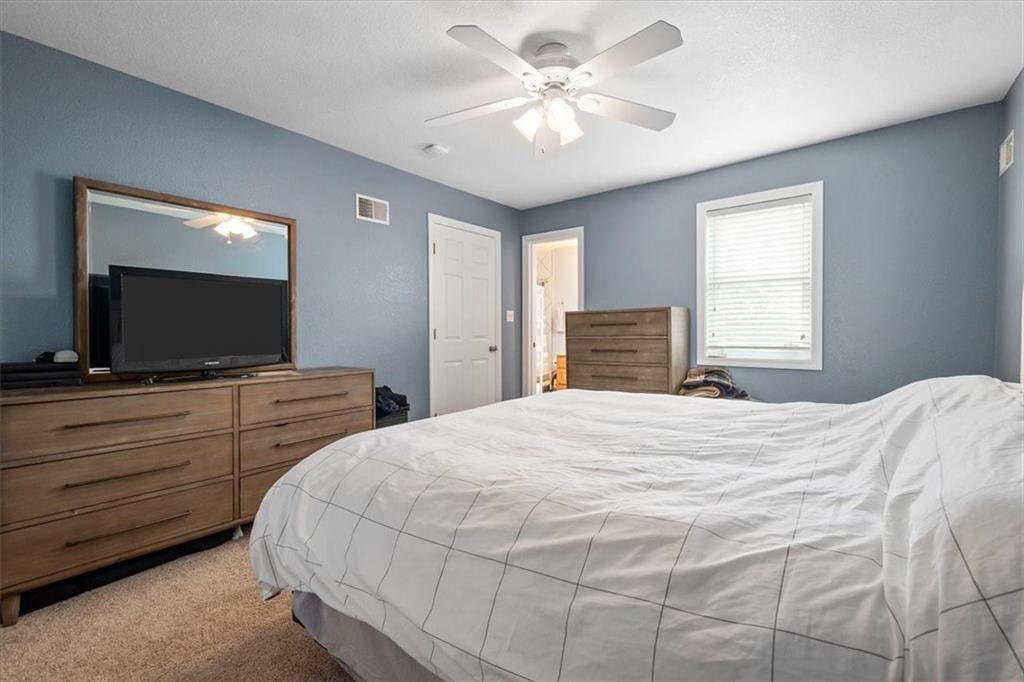 226 Bigham Street Pittsburgh, PA 15211 - Photo 13 of 25 a bedroom with a bed and a flat screen tv