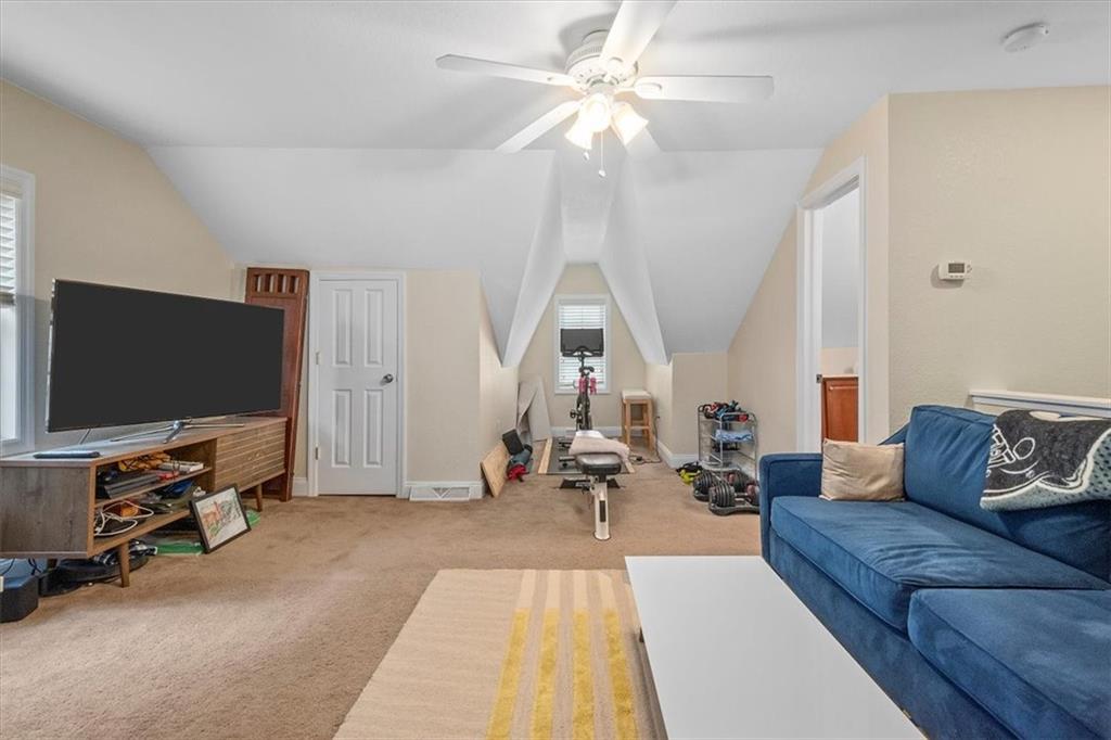 226 Bigham Street Pittsburgh, PA 15211 - Photo 15 of 25 a living room with furniture and a flat screen tv