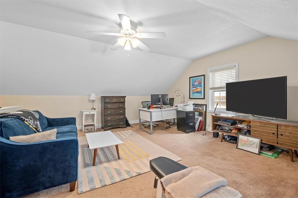 226 Bigham Street Pittsburgh, PA 15211 - Photo 16 of 25 a living room with furniture and a flat screen tv