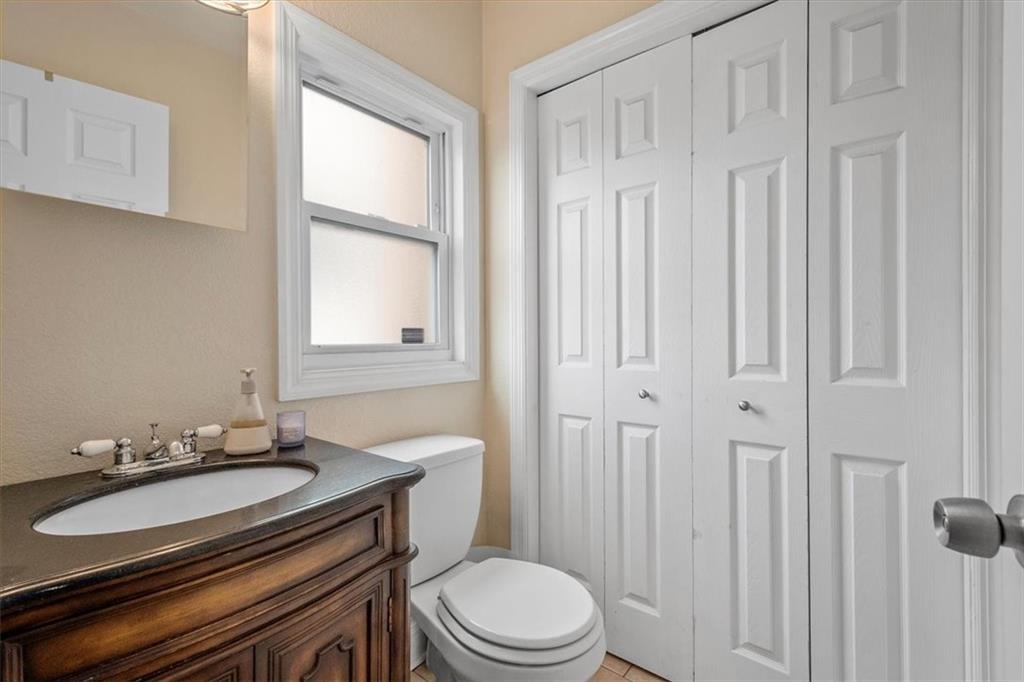 226 Bigham Street Pittsburgh, PA 15211 - Photo 17 of 25 a bathroom with a granite countertop sink toilet and mirror