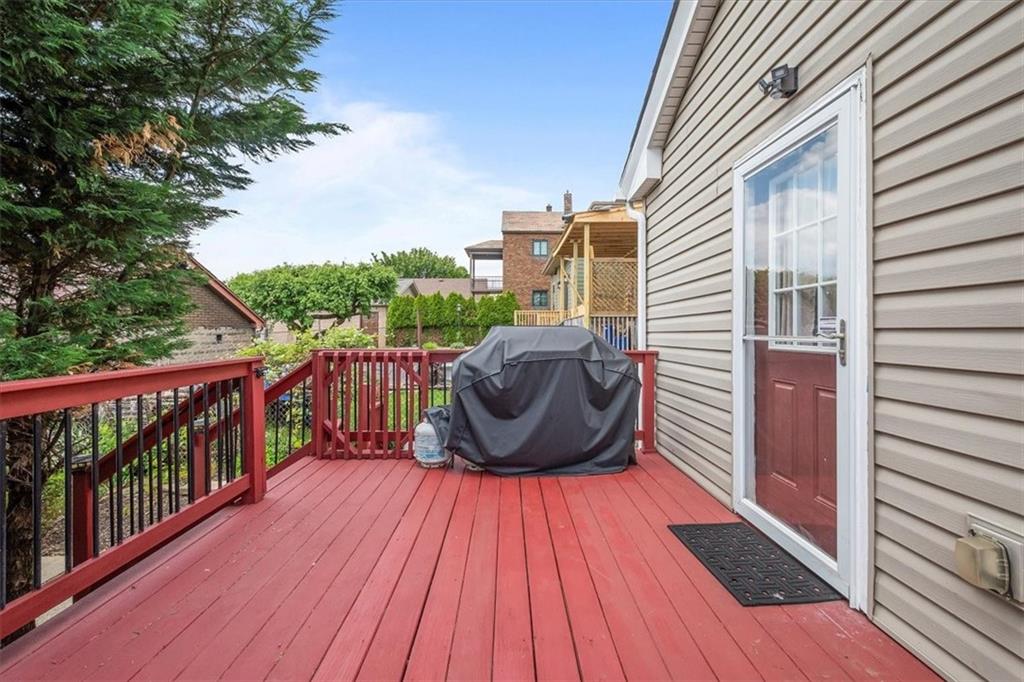 226 Bigham Street Pittsburgh, PA 15211 - Photo 22 of 25 a view of a balcony with wooden floor and fence
