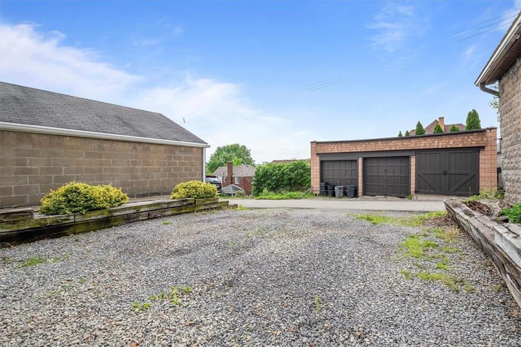226 Bigham Street Pittsburgh, PA 15211 - Photo 23 of 25 a front view of a house with garden