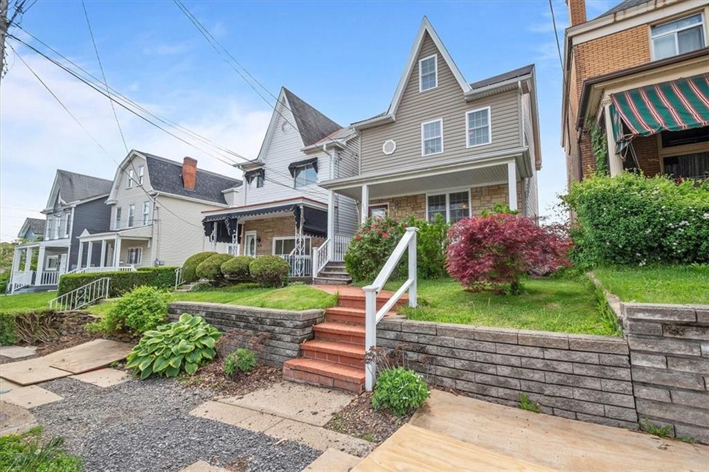 226 Bigham Street Pittsburgh, PA 15211 - Photo 24 of 25 a front view of a house with garden