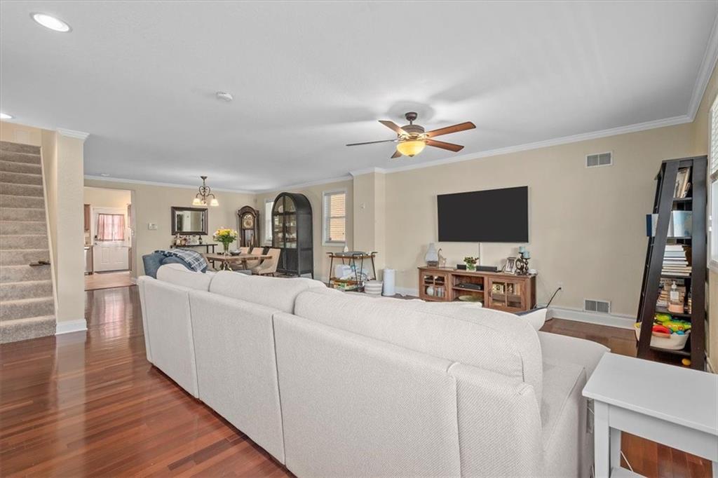 226 Bigham Street Pittsburgh, PA 15211 - Photo 3 of 25 a living room with furniture a flat screen tv and a fireplace