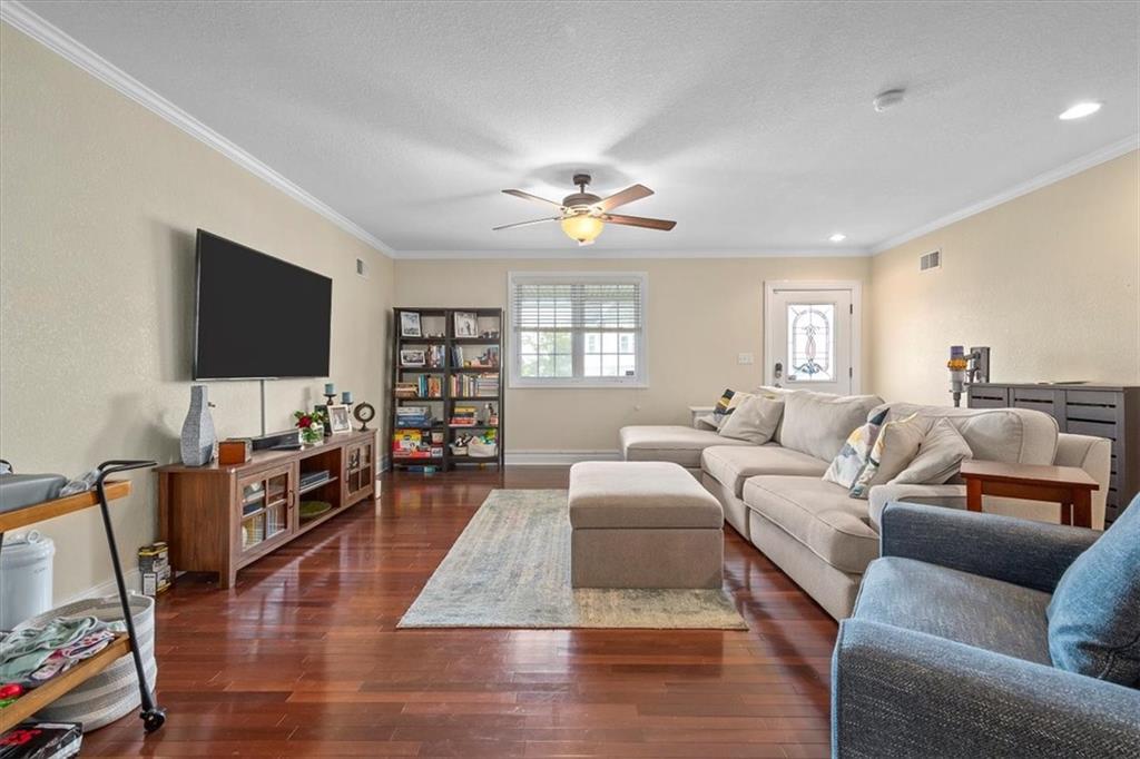226 Bigham Street Pittsburgh, PA 15211 - Photo 4 of 25 a living room with furniture and a flat screen tv