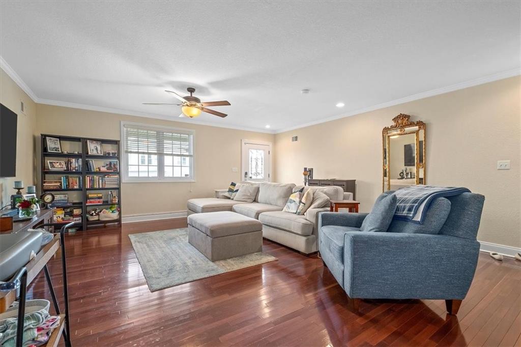 226 Bigham Street Pittsburgh, PA 15211 - Photo 5 of 25 a living room with furniture and a wooden floor