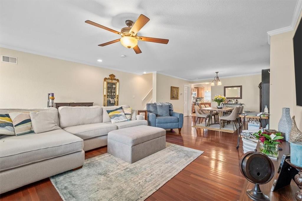 226 Bigham Street Pittsburgh, PA 15211 - Photo 7 of 25 a living room with furniture a ceiling fan and a rug