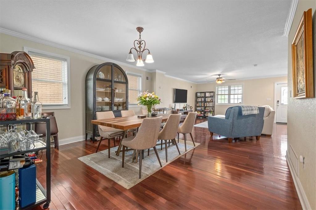 226 Bigham Street Pittsburgh, PA 15211 - Photo 9 of 25 a view of a dining room with furniture and wooden floor