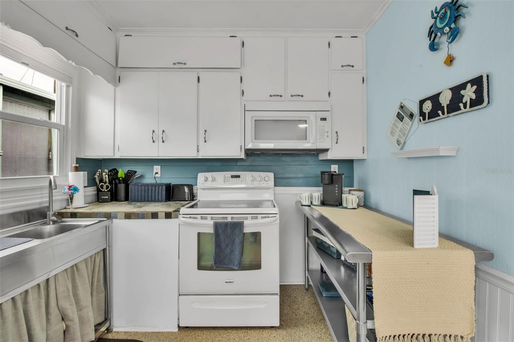 10315 Cortez Road West, Unit 123 Bradenton, FL 34210 - Photo 17 of 64 a kitchen with cabinets appliances and sink