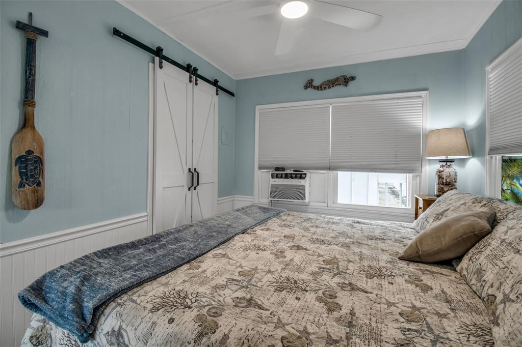 10315 Cortez Road West, Unit 123 Bradenton, FL 34210 - Photo 22 of 64 a bedroom with a bed and a window