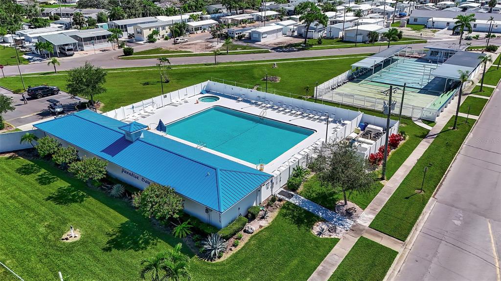 10315 Cortez Road West, Unit 123 Bradenton, FL 34210 - Photo 47 of 64 an aerial view of a house with a garden and trees