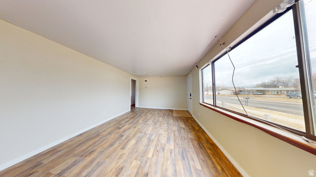 1348 Sagewood Road Price, UT 84501 - Photo 6 of 34 Unfurnished room with wood finished floors and baseboards