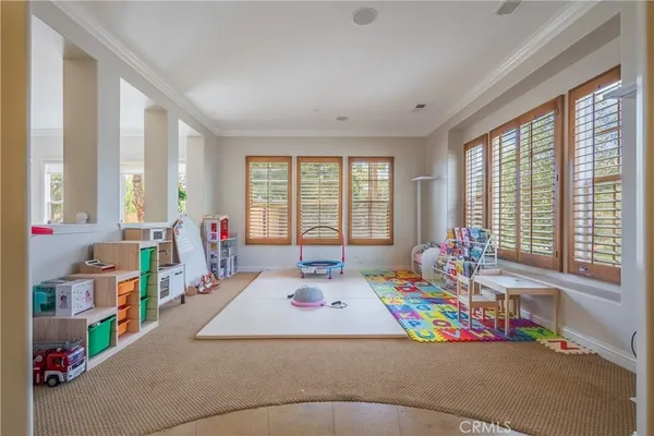 a view of empty room with window and front door