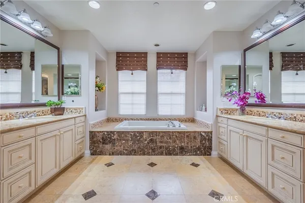 a front view of a house with a yard garage and outdoor seating