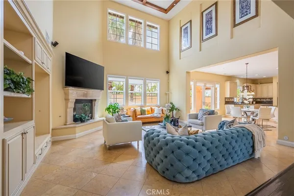 a living room with furniture fireplace and a flat screen tv