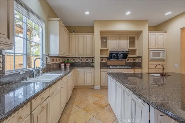 a dining room with furniture window and wooden floor