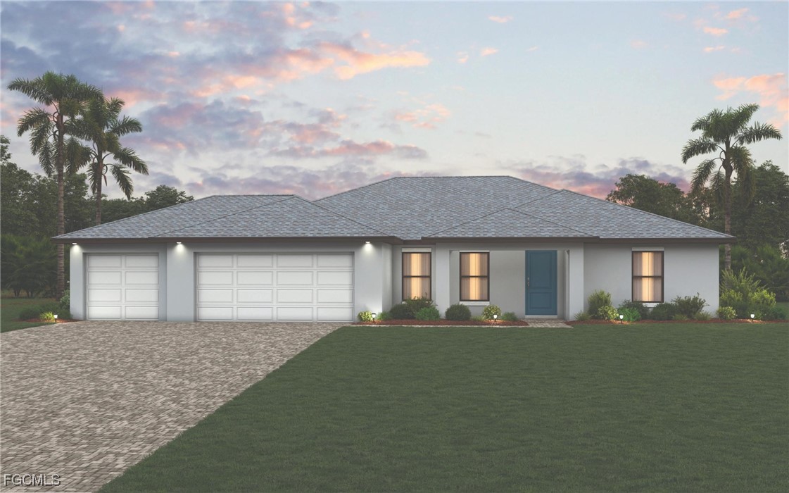 a front view of a house with a yard and garage