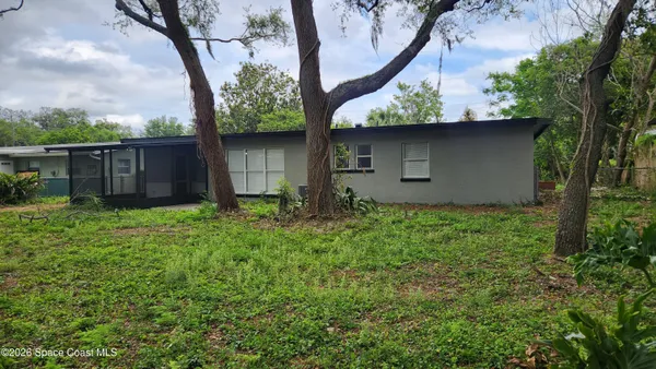 a backyard of a house with lots of green space