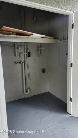 a view of a room with wooden floor