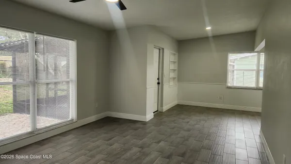 a view of an empty room with a window