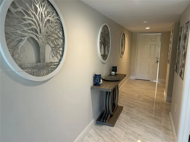 a view of a hallway with washer and dryer
