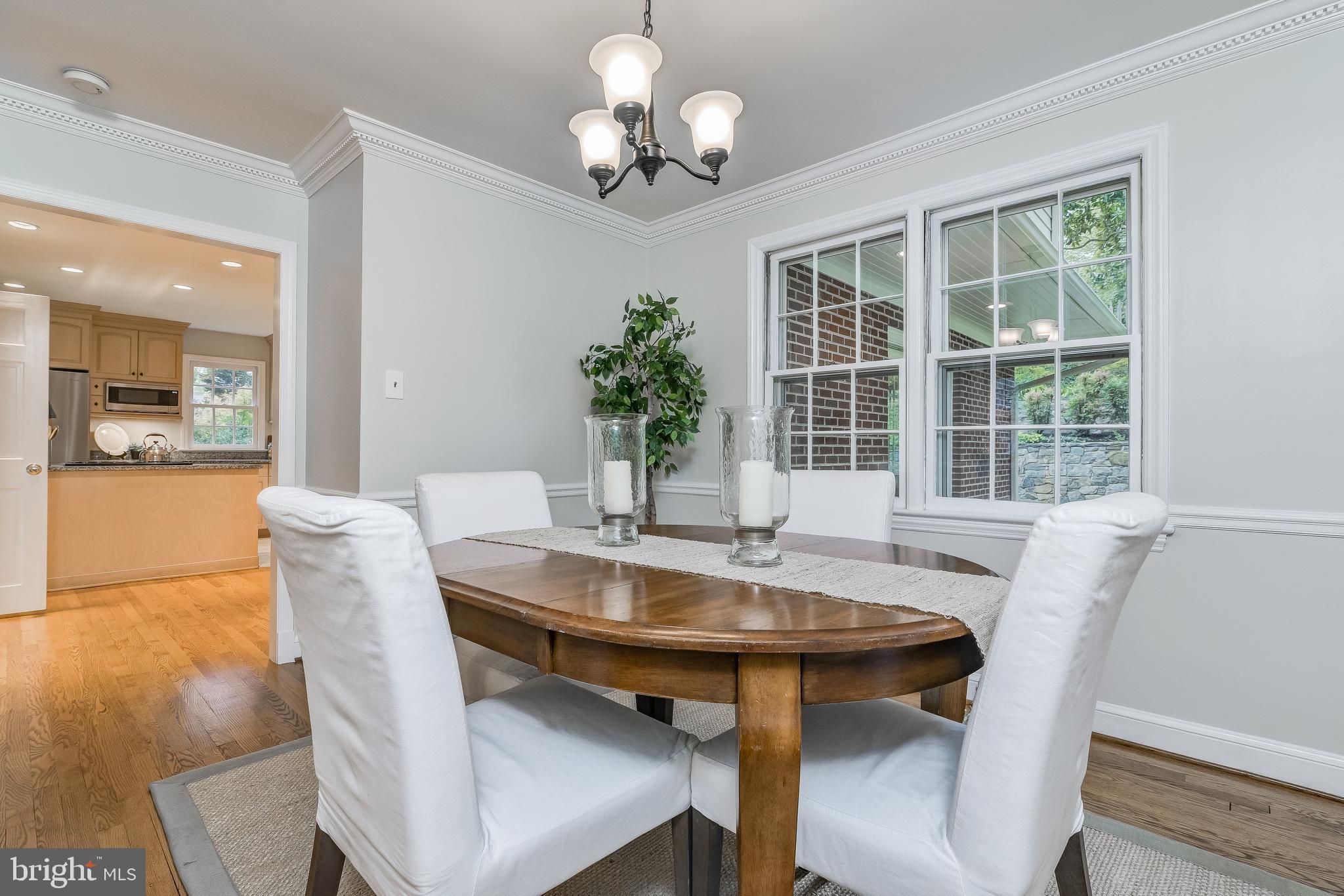 5911 Gloster Road Bethesda, MD 20816 - Photo 6 of 79 Dining Room with chair rail & crown molding.
