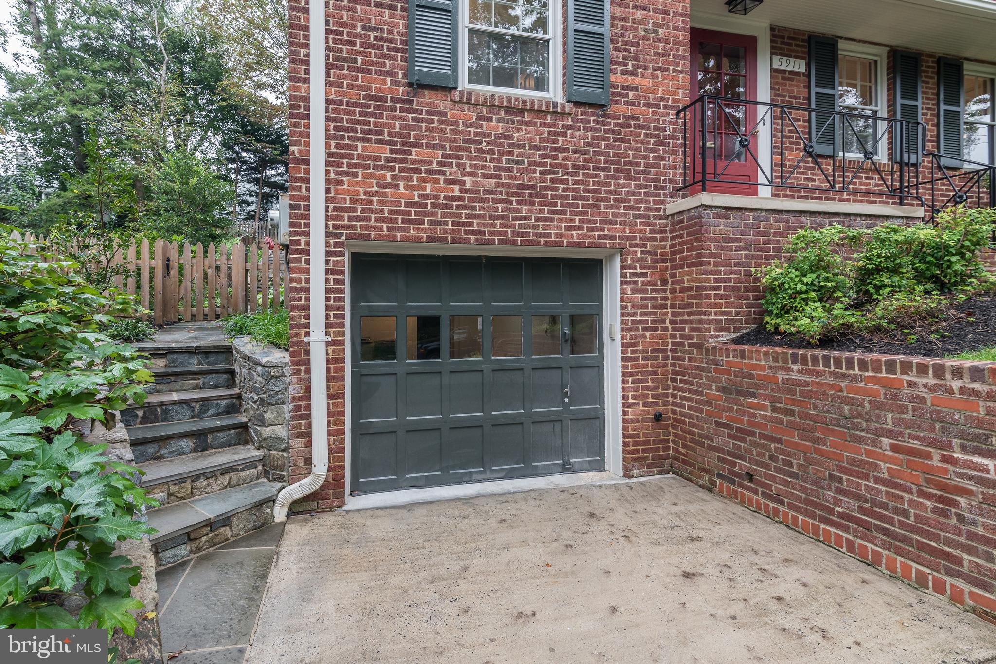 5911 Gloster Road Bethesda, MD 20816 - Photo 74 of 79 Garage door and concrete driveway.