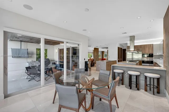 a view of a dining room kitchen and windows