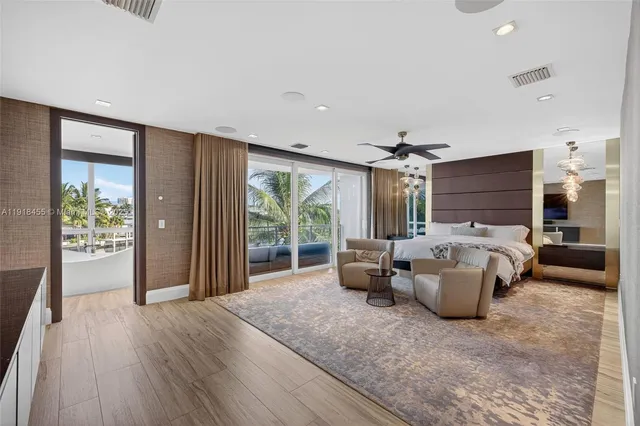 a living room with large window and a table