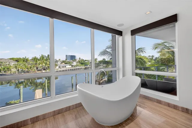 a spacious bathroom with a granite countertop sink and a mirror