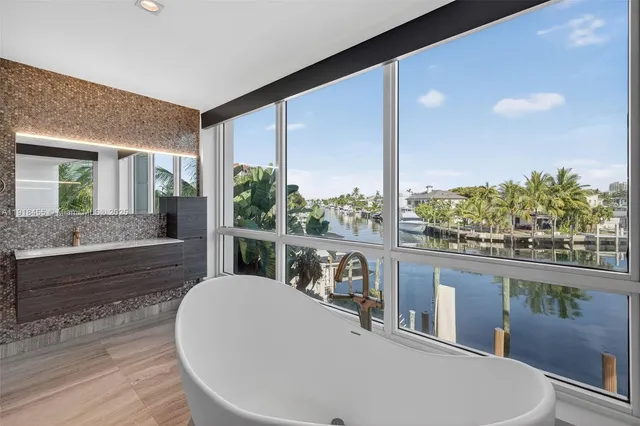 a bathroom with a bathtub and a sink