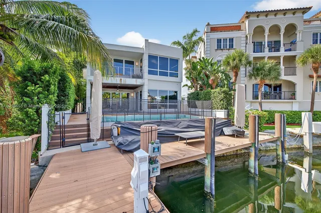 a view of a chairs and table in backyard