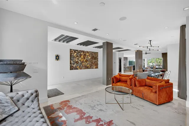 a living room with furniture and a rug